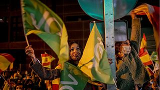 People gather outside the Vox party headquarters in Madrid last May.