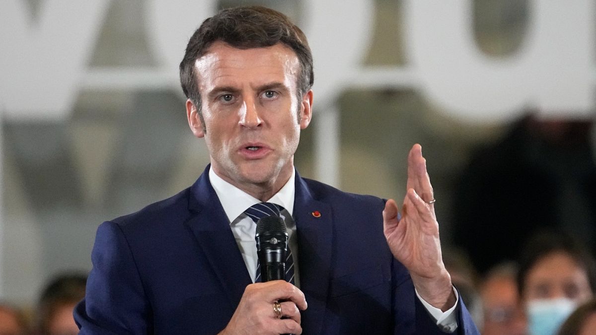 French President Emmanuel Macron and centrist candidate for the upcoming presidential election speaks as he meets residents in Poissy, west of Paris, Monday March 7, 2022.