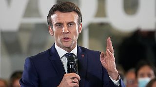 French President Emmanuel Macron and centrist candidate for the upcoming presidential election speaks as he meets residents in Poissy, west of Paris, Monday March 7, 2022.