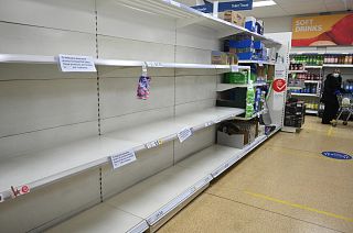 Empty shelves which previously held toilet paper are pictured at a supermarket in Cleckheaton, West Yorkshire during the COVID-19 pandemic. 