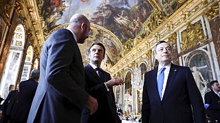 President of the European Council Charles Michel, French President Emmanuel Macron and Italian Prime Minister Mario Draghi attend a summit of EU leaders at Versailles