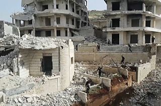 Young Syrian 'parkour' aficionados practise acrobatic moves and backflips in the war-ravaged Syrian town of Ariha, in the rebel-held northwestern Idlib province.
