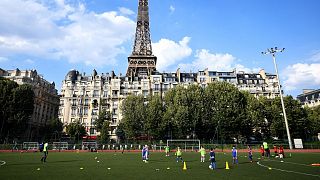 Youths take part in a football training session in Paris.