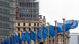 File: European Union flags outside EU headquarters in Brussels
