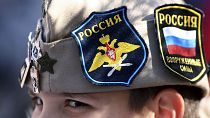 A boy wears Russian insignia on his hat as he rallies in Banjaluka, Bosnia, Saturday, 12 March 2022