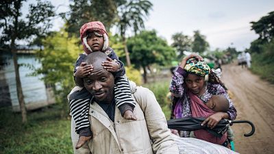 Displaced people flee the scene of an attack in DRC. Displaced people flee the scene of an attack in DRC.