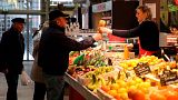 Customers no longer have to wear facemasks at a market in Biarritz, southwestern France.