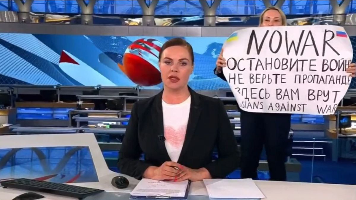 This photo reportedly shows an anti-war protester interrupting the Channel One broadcast.