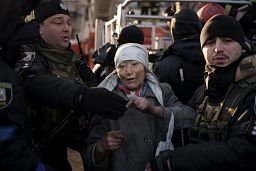 An elderly woman is helped by policemen after she was rescued by firefighters from inside her apartment after bombing in Kyiv, Ukraine, Tuesday, March 15, 2022. An elderly woman is helped by policemen after she was rescued by firefighters from inside her apartment after bombing in Kyiv, Ukraine, Tuesday, March 15, 2022.