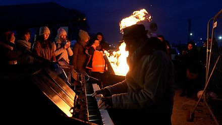 In Poland, a pianist plays to "spread peace through music".