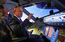 Russian President Vladimir Putin, who signed the new law, in the cockpit of an Aeroflot plane on 5 March.
