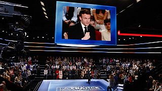 French President and centrist candidate for reelection Emmanuel Macron speaks during the show "France in the Face of War"