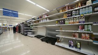 A view of empty shelves at a Tesco supermarket in Manchester, England, Sunday, Sept 12, 2021.