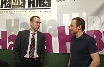 Nasha Niva journalist Andrey Skurko (R) pictured at their editorial office in Minsk in 2011.