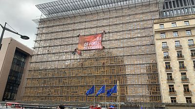 Greenpeace scale the Europa building in Brussels, Belgium, 17 March 2022.