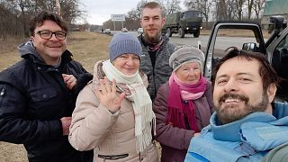 Alberto, right, during his rescue mission in Ukraine. Left to right: Alex, his sister, cousin and mother.