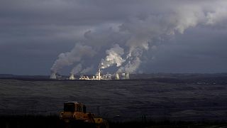 Smoke rises from chimneys of Turow power plant located by the Turow lignite coal mine near the town of Bogatynia, Poland.