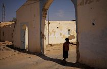 A Sahrawi refugee boy stands in the shadow in the Boujdour refugee camp.
