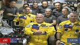 Russian cosmonauts Sergey Korsakov, Oleg Artemyev and Denis Matveev are seen during a welcome ceremony after arriving at the International Space Station, Friday, March 18.