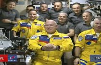 Russian cosmonauts Sergey Korsakov, Oleg Artemyev and Denis Matveev are seen during a welcome ceremony after arriving at the International Space Station, Friday, March 18.
