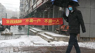 A slogan reads "All citizens Covid test, don't miss any household, don't miss any person" during a city wide lockdown, Changchun, China's Jilin province, March 14, 2022.