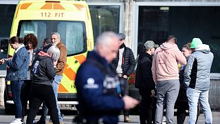 The scene near a gymnasium where witnesses and relatives of victims are received after a car crashed into a crowd of carnival-goers in La Louvière, March 20, 2022.