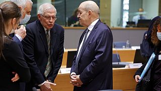 European foreign policy chief Josep Borrell, left, speaks with French Foreign Minister Jean-Yves Le Drian during a meeting of the EU foreign ministers
