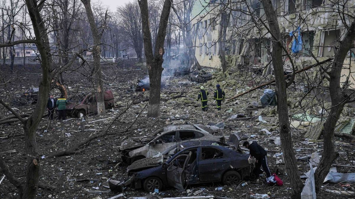 Ukrainian emergency employees work at a maternity hospital damaged by shelling in Mariupol.