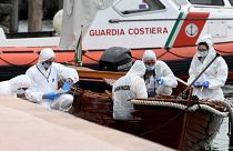 Italian forensic police inspect the damage on the boat in Salo on Lake Garda.