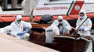 Italian forensic police inspect the damage on the boat in Salo on Lake Garda.