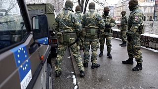 Austrian NATO peacekeeping EUFOR troops stop as they patrol in downtown Sarajevo, Bosnia, March 7, 2022.