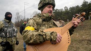 Ukrainian musician takes up arms