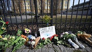 Floral tributes outside the Malmo Latin School on Tuesday, including a message that reads "Teachers are the most important".