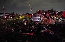 A car is flipped over after a tornado tore through the area in Arabi, La., March 22, 2022