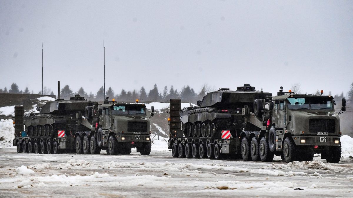 British troops and military equipment upon their arrival at Estonia's NATO Battle Group base in Tapa, Estonia, Friday, Feb. 25, 2022. 