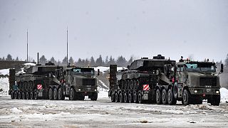 British troops and military equipment upon their arrival at Estonia's NATO Battle Group base in Tapa, Estonia, Friday, Feb. 25, 2022. 