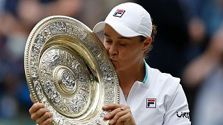 Australia's Ashleigh Barty poses with the trophy for the media after winning the women's singles final  on day twelve of the Wimbledon Tennis Championships in London. 2021