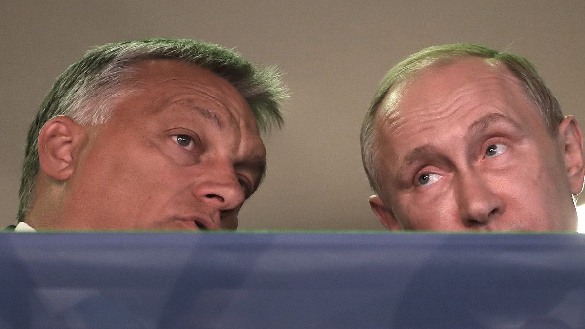 Russian President Vladimir Putin, right, and Hungarian Prime Minister Viktor Orban, left, arrive at the World Judo Championships as they meet in Budapest, Hungary, August 2017