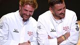French chefs Arnaud Donckele (L) and Dimitri Droisneau (R) celebrate after being awarded a third Michelin star during the 2022 edition of the Michelin guide