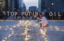 Protestors in Brussels call on EU leaders to impose a full ban on Russian fuels and to hold one minute of silence to honour the victims of war. 