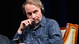 French novelist and poet Michel Houellebecq smokes an electric cigarette during a panel session in Budapest 2013