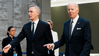 U.S. President Joe Biden, right, walks with NATO Secretary General Jens Stoltenberg prior to a group photo during an extraordinary NATO summit at NATO headquarters in Brussels