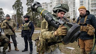 A Ukrainian Territorial Defence Forces member holds an NLAW anti-tank weapon, in the outskirts of Kyiv, Ukraine