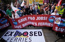 People take part in a union protest in solidarity with 800 P&O Ferries workers fired last week, opposite the Houses of Parliament, in London, Monday, March 21, 2022.