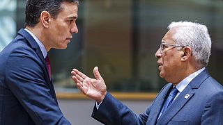 Spanish Prime Minister Pedro Sanchez speaks with Portuguese Prime Minister Antonio Costa during a round table meeting at an EU summit in Brussels