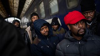 African residents in Ukraine wait at the platform inside Lviv railway station, Sunday, Feb. 27, 2022, in Lviv, west Ukraine.