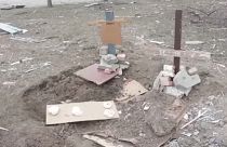 Makeshift graves of people killed during shelling in Mariupol - 26th March 2022