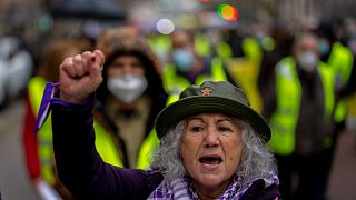 A woman shouts slogans during a protest of high energy prices in Madrid, Spain, Wednesday, March 23, 2022
