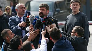 Mykhailo Podolyak, a member of the Ukrainian delegation, right, stands as a translator gives his statement after peace talks in Istanbul