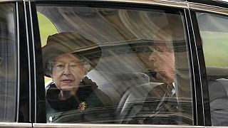Queen Elizabeth II and her son Prince Andrew attending a memorial service for Prince Philip.